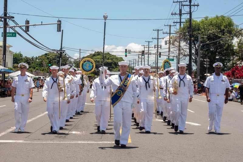 PHOTO CAPTION:  HILO, Hawai‘i (2025) - Musician 1st Class Arthur Robinson, drum major, leads the US Pacific Fleet Band in the 62nd Annual Merrie Monarch Festival Royal Parade in Hilo, Hawai‘i. Participation in this parade continues to strengthen the cultural and historical connection between Hawai‘i and the US Navy. Hilo, Hawai‘i, Apr. 26, 2025 (U.S. Navy photo by Musician 3rd Class Elizabeth Davis/Released)